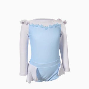 One-piece girls swimsuit with long sleeves and ballgown-style peplum inspired by Cinderella, styled for fairytale pool fun

Girls UPF swim rash guard in Cinderella blue with embroidered neckline and ruffle sleeves for toddler princess beachwear

Blue and white long sleeve princess rash guard swimsuit with peplum skirt, styled for toddler sun safety and fairytale flair