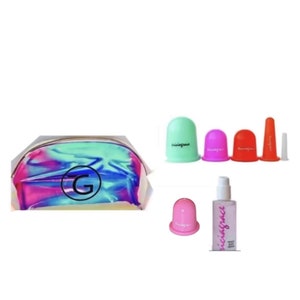 May include: A set of four silicone suction cups in green, pink, red, and clear, a small pink silicone suction cup, a bottle of massage oil, and a holographic makeup bag with the letter G printed on it.