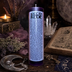 May include: A tall, cylindrical purple pillar candle featuring a white label printed with the text Wiccan Rede by Kentucky Conjure. The label contains a detailed poem in black font, and the candle has a single white wick centred at the top.