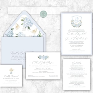 May include: A wedding stationery suite featuring light blue envelopes with floral hydrangea and calla lily liners, a wax seal, and white cards with blue text. The set includes an invitation, a rehearsal dinner card, a details card, and an RSVP card.