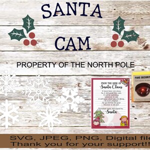 May include: A digital file with a Christmas theme. The image includes the words "SANTA CAM" and "PROPERTY OF THE NORTH POLE". There are snowflake cutouts, a letter from Santa, and a fake security camera box. The file formats are SVG, JPEG, and PNG.