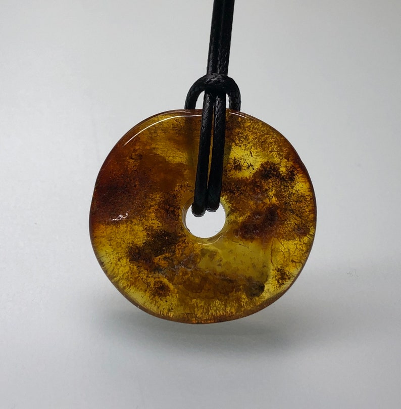Natural Baltic amber amulet Baltic amber donut yellow brown color amber ring with black string