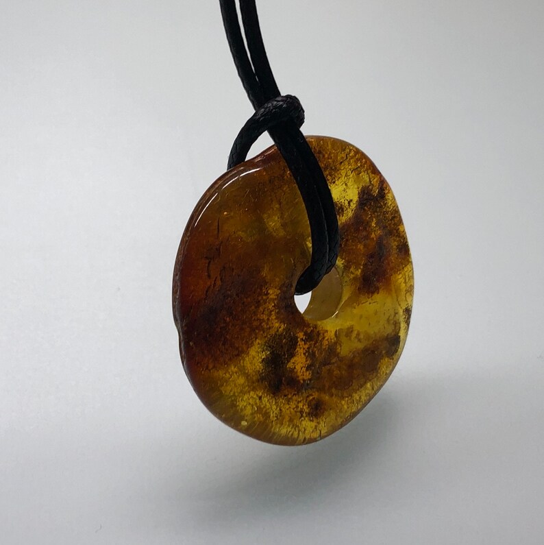 Natural Baltic amber amulet Baltic amber donut yellow brown color amber ring with black string