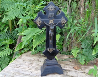 old crucifix on foot, Christ on black wood, religious cross, Gothic style, French antique