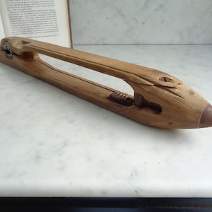 old weaving shuttle, vintage wooden decor, souvenir object, old craft tool, France