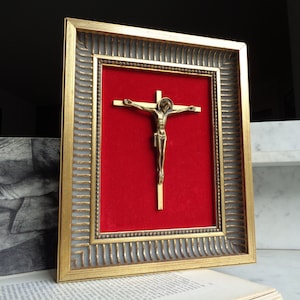 gilded wood frame with bronze crucifix on red velvet, vintage religious decoration, mid-century France