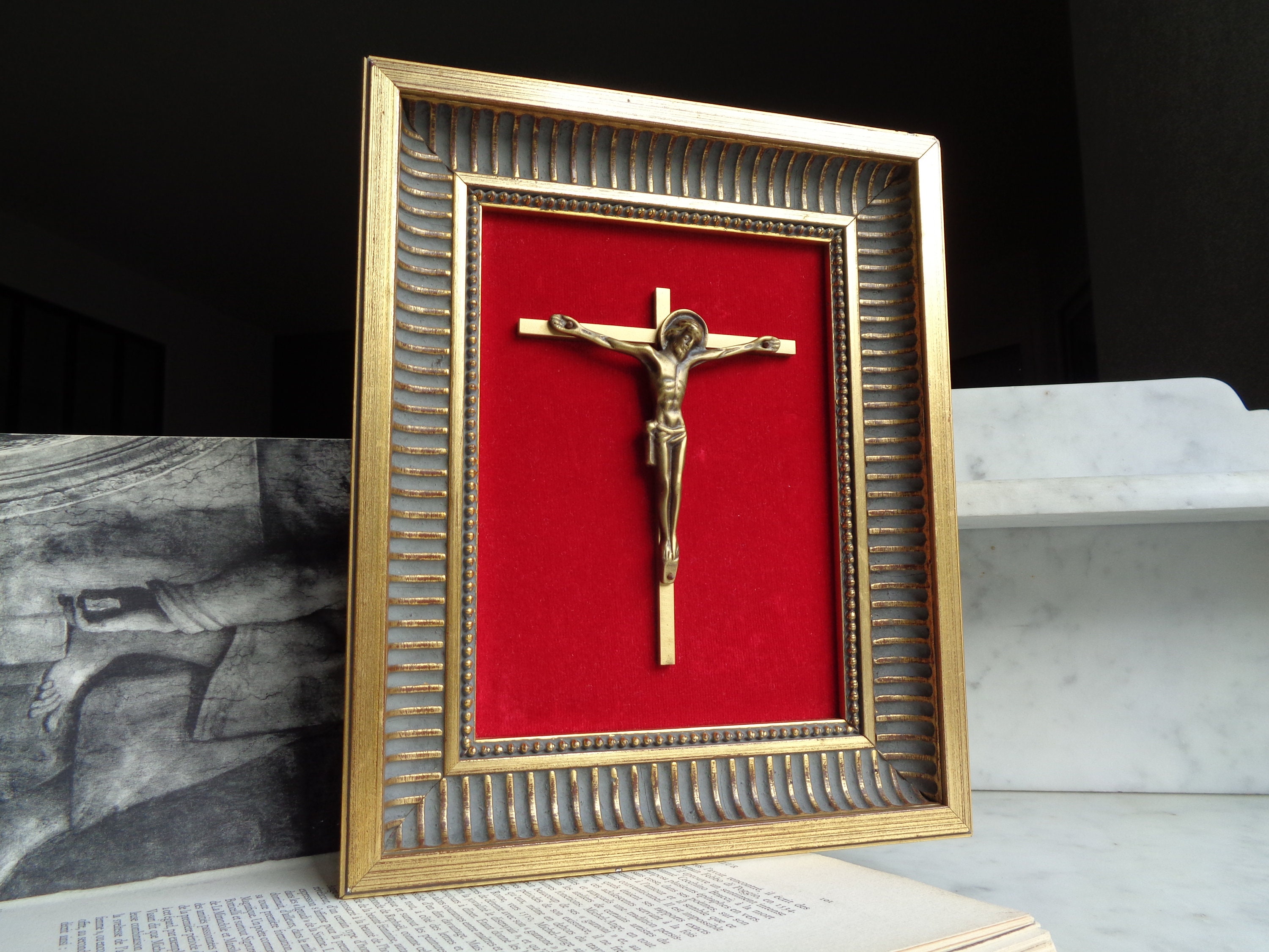 gilded wood frame with bronze crucifix on red velvet, vintage religious decoration, mid-century France