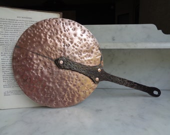 hammered copper lid with wrought iron handle, hanging, old kitchen utensil, antique farmhouse decor, France