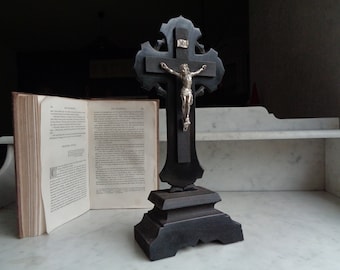 old crucifix on foot, Christ on black wood, religious cross, Gothic style, French antique