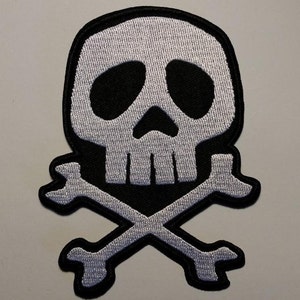 May include: A white skull and crossbones patch with black outlines. The crossbones are shaped like spanners.