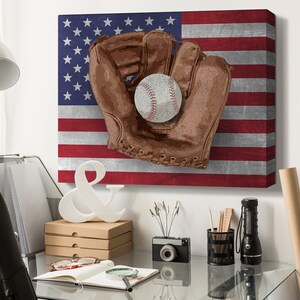 May include: A baseball glove with a baseball inside, against a backdrop of the American flag. The flag is distressed and has a vintage look.