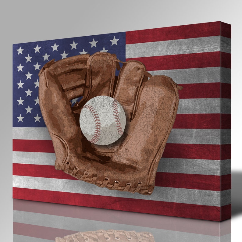 May include: A brown leather baseball glove with a white baseball inside, set against a red, white, and blue American flag background.