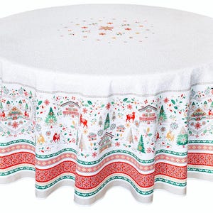 May include: White round tablecloth with a red, green, and white winter scene pattern. The pattern features houses, trees, deer, and snowflakes. The tablecloth has a scalloped edge.