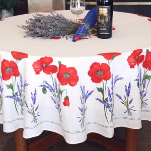 May include: White round tablecloth with a red poppy and lavender floral pattern.