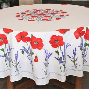 May include: White round tablecloth with a red poppy and lavender floral pattern. The tablecloth has a white border with a thin black trim.