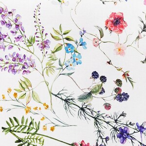 May include: A white background with a floral pattern featuring purple, blue, pink, and yellow flowers, green leaves, and black berries.
