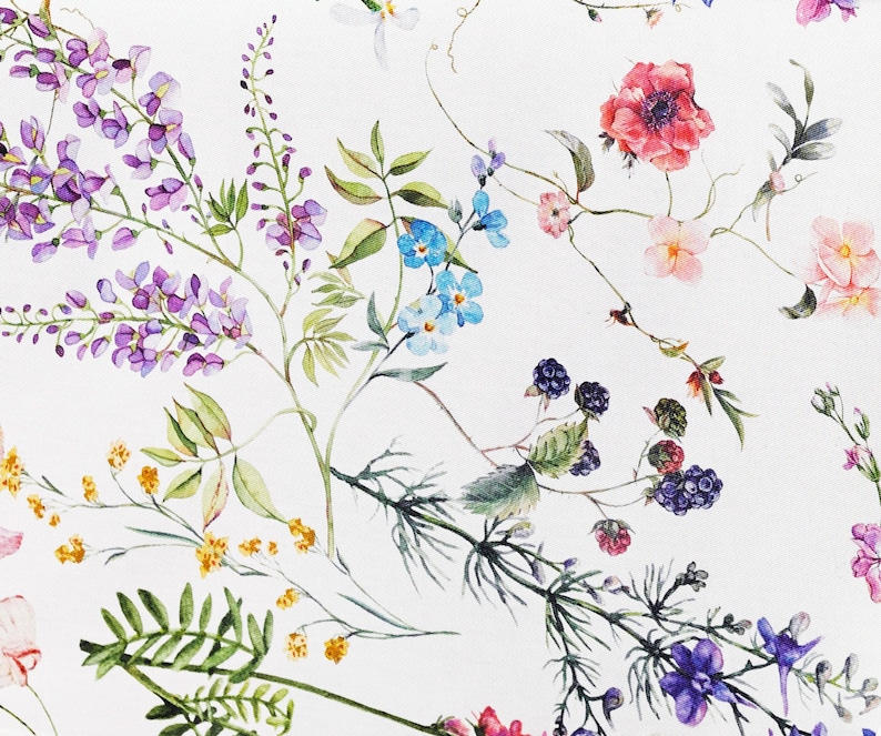 May include: A white background with a floral pattern featuring purple, blue, pink, and yellow flowers, green leaves, and black berries.