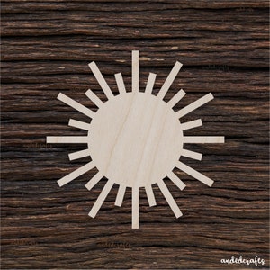 May include: A wooden sunburst cutout with a circular center. The sunburst has 20 rays extending from the center.