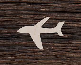 May include: A white wooden airplane cutout on a dark brown wood background.