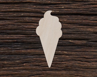 May include: A white wooden ice cream cone cutout on a dark brown wood background.