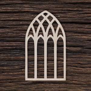 May include: A white wooden cutout of a gothic arch window with a diamond pattern at the top and three arched sections below.