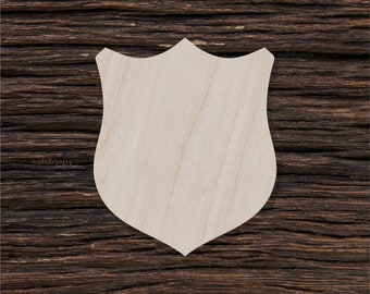 May include: A plain wooden shield shape, perfect for crafting and decorating. The shield is made of unfinished wood and has a smooth surface.