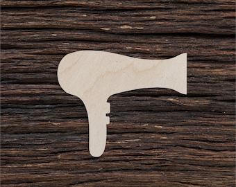 Puede incluir: Un recorte de madera blanco de un secador de pelo sobre un fondo de madera marrón oscuro.