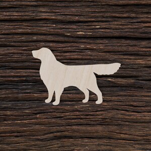 Può includere: Una silhouette di cane in legno bianco su uno sfondo di legno marrone scuro.