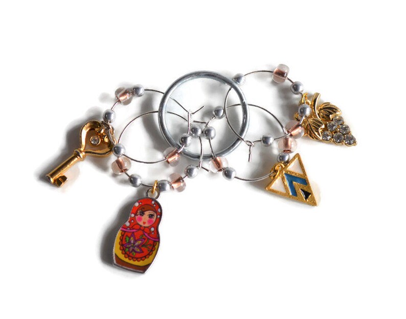 Fun Set of Mixed Gold Tone Wine Charms ~ Set of Four \u2013 Russian Doll Key Grape Cluster and Art Deco Triangle ~ READY TO SHIP