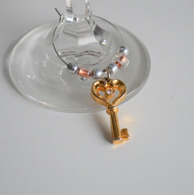 Fun Set of Mixed Gold Tone Wine Charms ~ Set of Four \u2013 Russian Doll Key Grape Cluster and Art Deco Triangle ~ READY TO SHIP