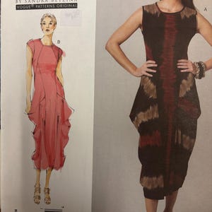 May include: A Vogue pattern featuring two dress designs. One is a sleeveless, knee-length dress with a tie-dye pattern in shades of brown and red. The other is a pink, knee-length dress with a draped design. The text "TODAY'S FIT" is visible.
