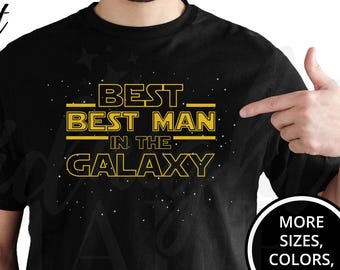 May include: Black t-shirt with yellow text that reads "Best Best Man in the Galaxy".