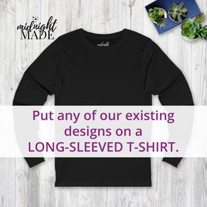 May include: A black long-sleeved t-shirt with the text "Put any of our existing designs on a LONG-SLEEVED T-SHIRT." The shirt has a crew neck and long sleeves. The brand name "midnight MADE" is visible in the upper left corner.