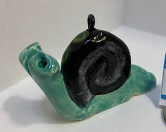 Ornamento de caracol desacelere: Reid