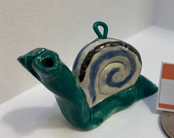 Ornamento de caracol para desacelerar: fiapos