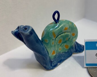 Ornamento de caracol desacelere: Stella