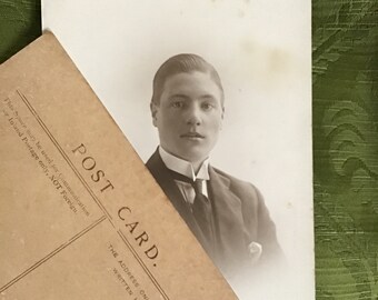 Vintage antique Edwardian sepia theatrical photograph of a young man
