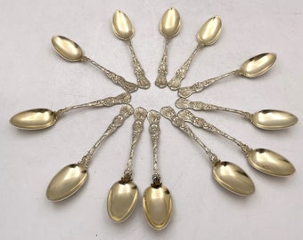 Durgin Set of 12 Gilt Sterling Silver Teaspoons in Heraldic Pattern