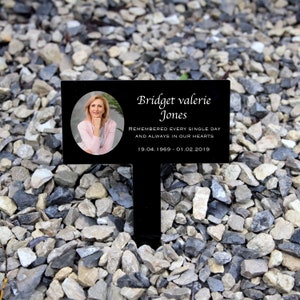May include: Black memorial plaque with a photo of a woman, the text "Bridget Valerie Jones", "Remembered every single day and always in our hearts", and the dates "19.04.1969 - 01.02.2019".