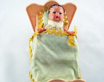 Old bed with doll, (celluloid) approx. 12 cm overall length