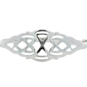 May include: A silver Celtic knot bangle bracelet with a delicate, intricate design.