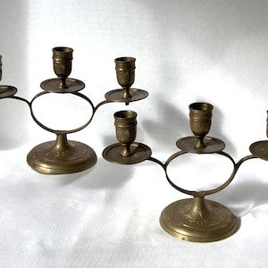 May include: A set of three ceramic mugs with a speckled, matte finish. Each mug features a different color: light blue, cream, and gray. The mugs have a simple, modern design, perfect for coffee or tea.