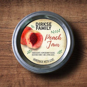 May include: A jar lid with a label for "Peach Jam" from "Dirkse Family." The label features a watercolor illustration of a peach and text that reads "Homemade with Love." Ingredients include homegrown peaches, backyard honey, and lemon juice.