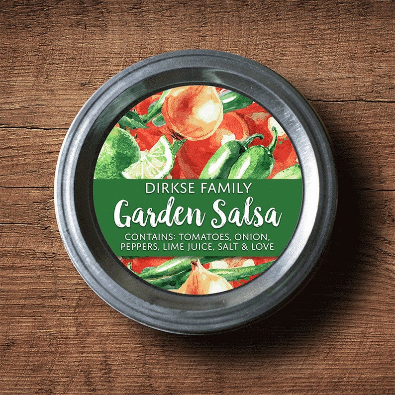 May include: A silver jar lid with a green and white label that reads "DIRKSE FAMILY Garden Salsa CONTAINS: TOMATOES, ONION, PEPPERS, LIME JUICE, SALT & LOVE". The label features a watercolor illustration of tomatoes, onions, peppers, and limes.