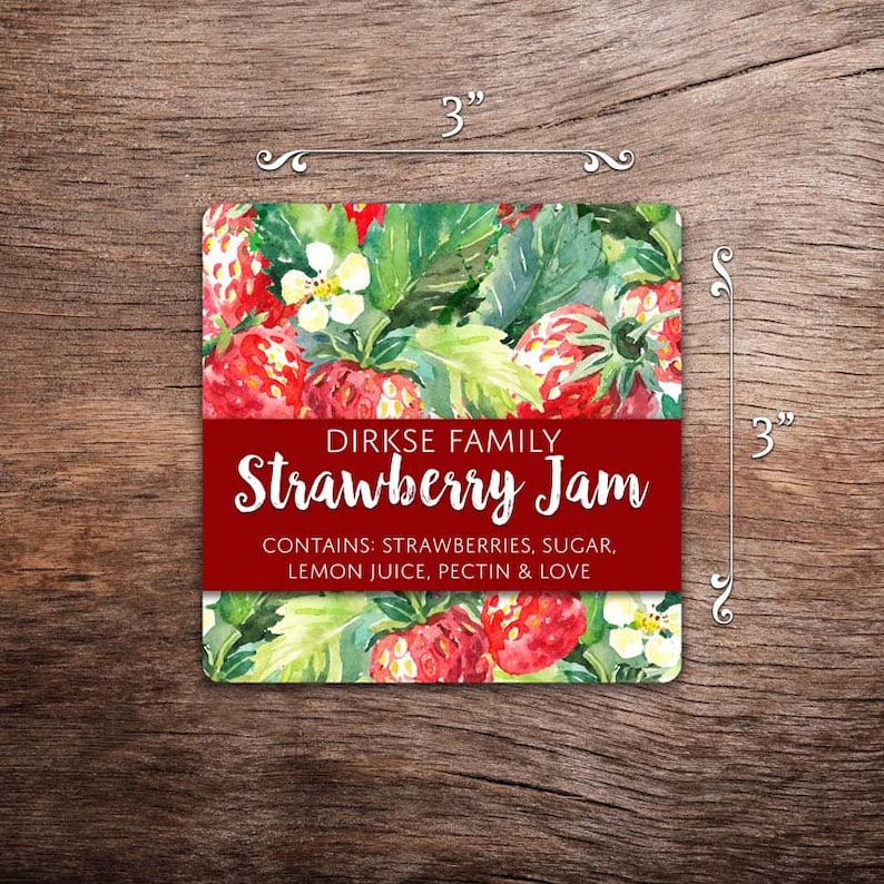 May include: A red and white label with the text "DIRKSE FAMILY Strawberry Jam" and the words "CONTAINS: STRAWBERRIES, SUGAR, LEMON JUICE, PECTIN & LOVE". The label is decorated with a watercolor illustration of strawberries and leaves.