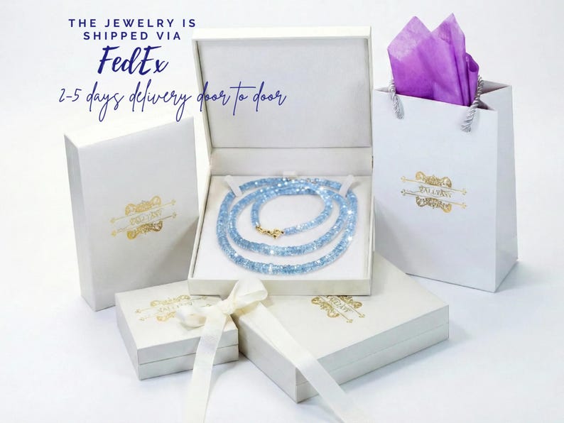 a collection of jewelry items, including a necklace, a box, and a gift bag, all presented in a white and gold color scheme.