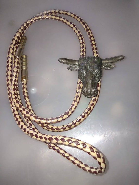 country & western bull bolo tie bronze tone on leather lace.