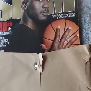 May include: A SLAM magazine cover featuring Michael Jordan holding a basketball. The cover is a special anniversary collector's issue. The text reads "100th Issue Blowout!" and "Soul on Ice: Allen Iverson & Our Hottest Cover Ever."