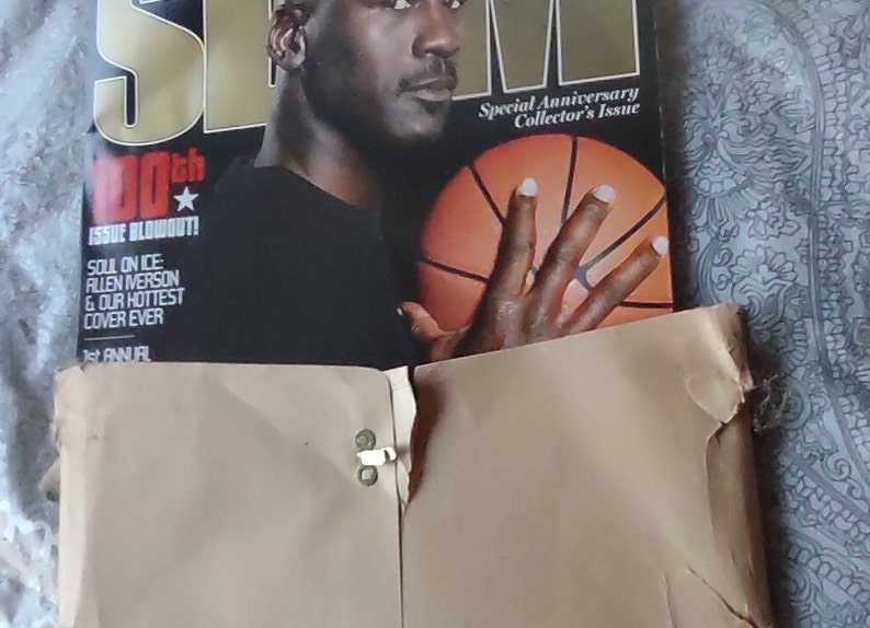 May include: A SLAM magazine cover featuring Michael Jordan holding a basketball. The cover is a special anniversary collector's issue. The text reads "100th Issue Blowout!" and "Soul on Ice: Allen Iverson & Our Hottest Cover Ever."