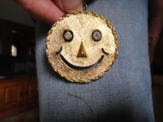 smiley brooch